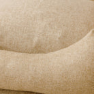 Close up view of wild nest Cotswolds handmade wool dog bed beige wool 